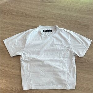 Ordinary Practice Curved Seam Tee in White